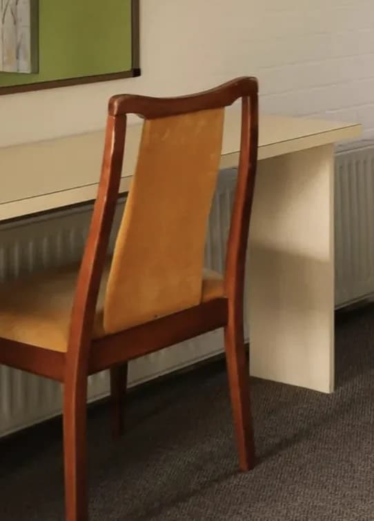 A timber chair at the desk in the Family Room.